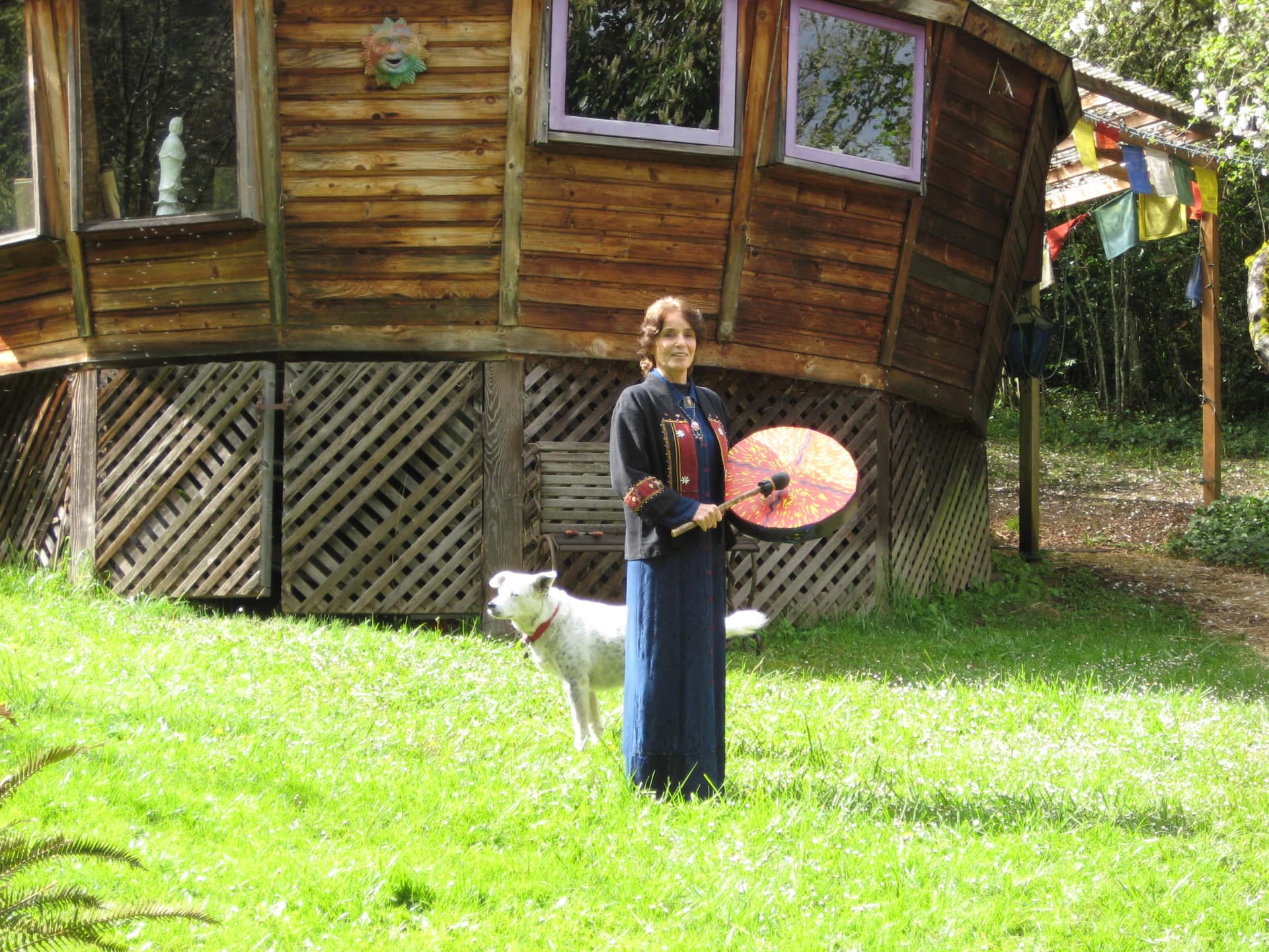 Karuna Gatton in front of her healing yurt